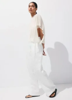 Asymmetrical knitted cape