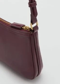 Crossbody bag with charms and rings