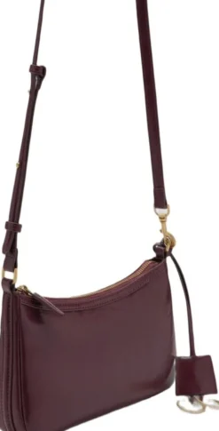 Crossbody bag with charms and rings